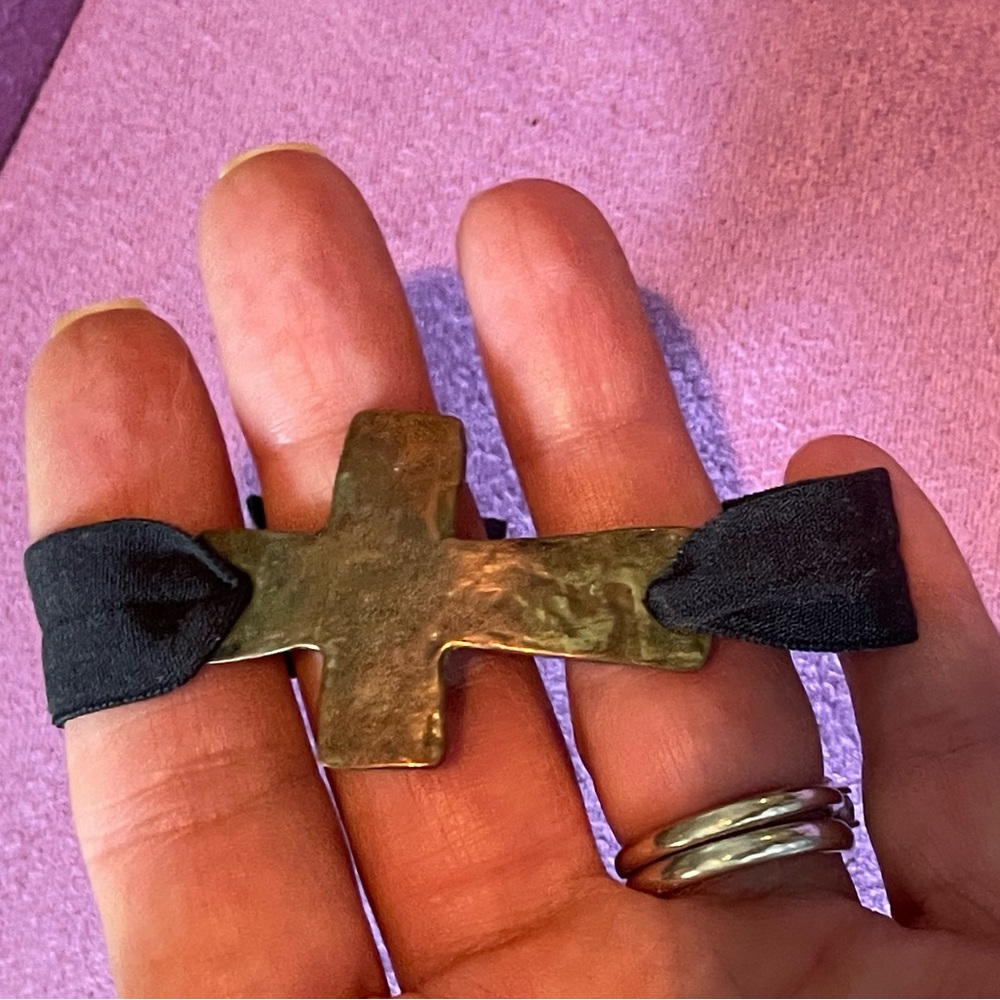 Black band bracelet with hammered gold cross